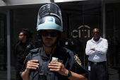 NYPD and security stand outside the entrance to the global headquarters of Citigroup as Climate control activists demonstrate in New York City