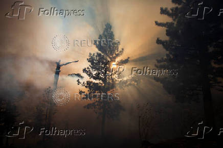 The Bridge Fire burns the mountain communities to the northeast of Los Angeles, in Wrightwood