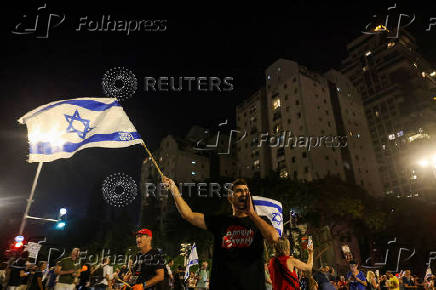 People attend a protest against the government and to show support for the hostages who were kidnapped during the deadly October 7 attack, in Tel Aviv