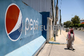 FILE PHOTO: In West Bank, Pepsi and Coke bottlers face can and sugar shortage