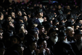 Mourners attend the funeral of Israeli rabbi, Zvi Kogan, in Kfar Habad