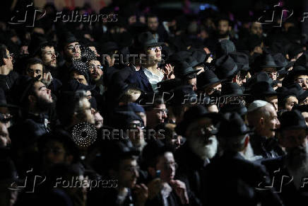 Mourners attend the funeral of Israeli rabbi, Zvi Kogan, in Kfar Habad