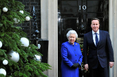 FILE PHOTO: Britain's Queen Elizabeth is greeted by Prime Minister David Cameron as she arrives at Number 10 Downing Street in London