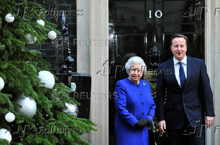 FILE PHOTO: Britain's Queen Elizabeth is greeted by Prime Minister David Cameron as she arrives at Number 10 Downing Street in London