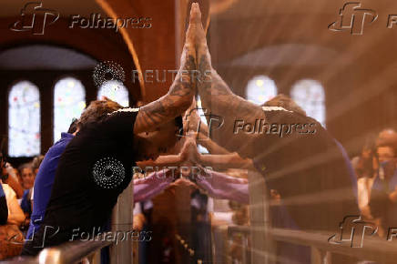 People pay homage to Brazil's patron saint at Cathedral Basilica of the National Shrine of Our Lady Aparecida