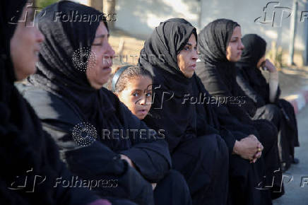 Palestinians mourn loved ones killed in Israeli strikes, in Khan Younis in the southern Gaza Strip