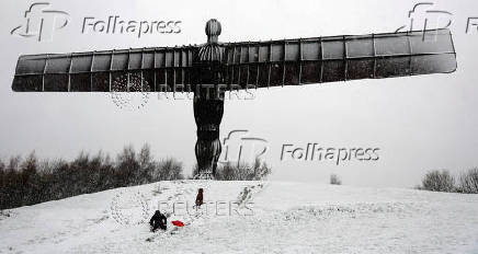 Snowfall at Antony Gormley's Angel of the North, in Gateshead