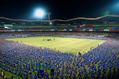 Participants wearing colourful attire, perform Bharatanatyam dance, at the Jawaharlal Nehru International Stadium, in Kochi