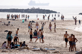 People spend time on the beach, in Ashkelon