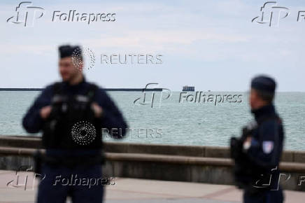 Security and rescue forces work on the beach of Wimereux, near Calais