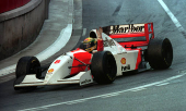 FILE PHOTO: Senna of Brazil in his McLaren Ford raises his hand after winning the 1993 Monaco Grand Prix