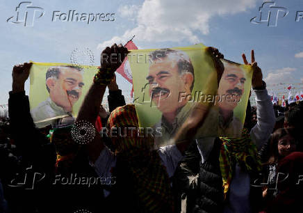 FILE PHOTO: Pro-Kurdish party supporters display flags with portrait of jailed PKK leader Abdullah Ocalan