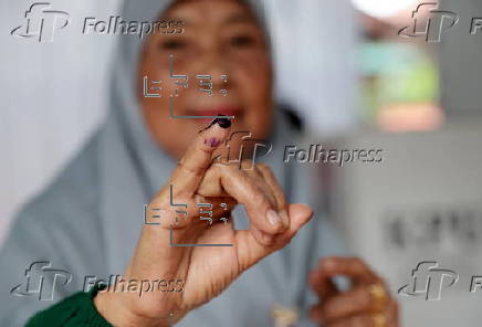 Voters cast their ballows in regional government elections in Indonesia