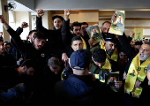 Mourners react during the funeral of Hezbollah commander Al-Hajj Mustafa Abdel Latif al-Zein, after a ceasefire agreement between Hezbollah and Israel took effect, in Beirut