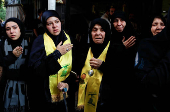 Mourners react during the funeral of Hezbollah commander Al-Hajj Mustafa Abdel Latif al-Zein, after a ceasefire agreement between Hezbollah and Israel took effect, in Beirut