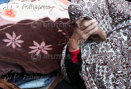 Palestinians mourn loved ones killed in Israeli strikes, in Deir Al-Balah in the central Gaza Strip