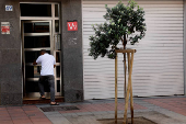 A man enters a vacation housing building in Las Palmas de Gran Canaria