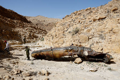 Apparent remains of a ballistic missile lie in the desert, following a massive missile and drone attack by Iran on Israel, near city of Arad