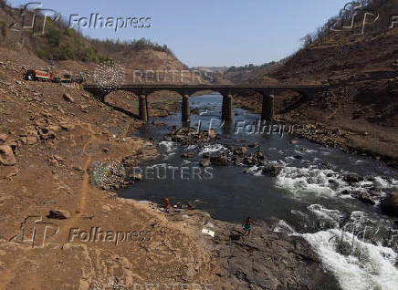 A drone view of people washing clothes at the Vaitarna river in Kasara
