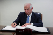 The European Union's High Representative for Foreign Affairs and Security Policy, Josep Borrell, signs a guest book at the Jordanian Foreign Ministry, in Amman