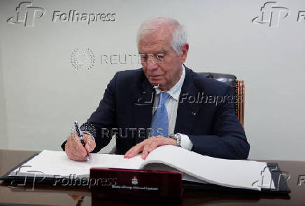 The European Union's High Representative for Foreign Affairs and Security Policy, Josep Borrell, signs a guest book at the Jordanian Foreign Ministry, in Amman