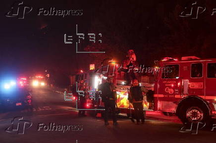 Firefighters battle the Sunset Wildfire in Los Angeles, California