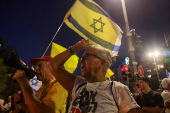 People attend a protest against the government and to show support for the hostages who were kidnapped during the deadly October 7 attack, in Tel Aviv