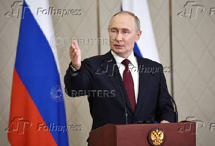 Russian President Putin attends a press conference in Astana