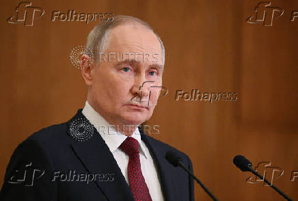 Russian President Putin attends a press conference in Astana