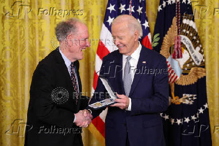 U.S President Biden gives the Presidential Citizens Medal, one of the country's highest civilian honors, during a ceremony at the White House in Washington