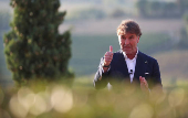 FILE PHOTO: Italian fashion tycoon Brunello Cucinelli speaks during a presentation of the newly restored medieval hamlet at valley at his company headquarters in Solomeo village near Perugia