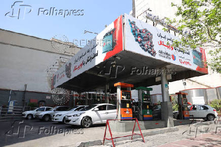 Cars are seen in a gas station in Tehran