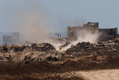 An Israeli tank manoeuvres inside the Gaza Strip