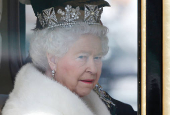 FILE PHOTO: Britain's Queen Elizabeth is driven by carriage from Buckingham Palace to the Houses of Parliament during the State Opening of Parliament in central London