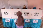 Voters cast their ballows in regional government elections in Indonesia