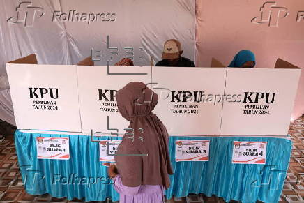 Voters cast their ballows in regional government elections in Indonesia