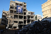 A banner that reads 'Made in USA' hangs on a damaged building in the Chiyah district of Beirut's southern suburbs