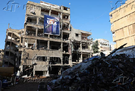 A banner that reads 'Made in USA' hangs on a damaged building in the Chiyah district of Beirut's southern suburbs