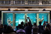 Artistic swimming performance event to mark 100 days before the 2024 Paris Olympic Games starts, in London