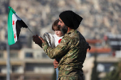 People gather after Syria's Bashar al-Assad was ousted in central Damascus