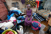 Residents recover their belongings after Nairobi river burst its banks in Mathare Valley settlement in Nairobi