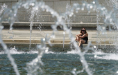 Visitor cools off at the World War II Memorial  in Washington