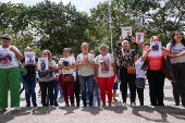 Relatives of detained Venezuelans protest, outside the public prosecutor's headquarters, in Caracas