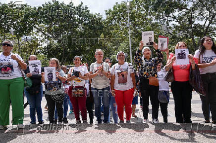 Relatives of detained Venezuelans protest, outside the public prosecutor's headquarters, in Caracas