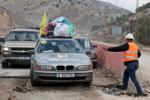 People who had fled the hostilities in Lebanon to Syria return to Lebanon through the Masnaa border crossing between the two countries