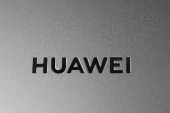 FILE PHOTO: A Huawei logo is seen on a device at a media event in London