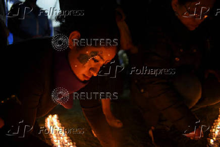 Demonstrators hold a vigil ahead of International Day for the Elimination of Violence Against Women, in Guatemala City