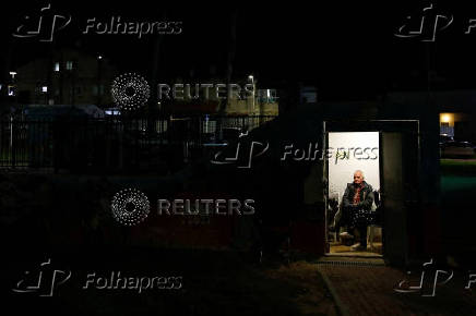 Israelis gather at a bomb shelter following rocket attacks from Lebanon towards Israel, in Acre