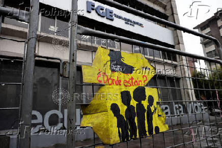 People gather to protest against the forced disappearance of four minors, in Quito