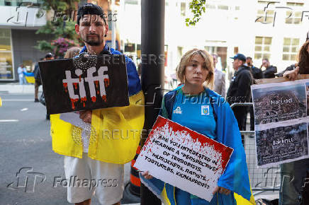 Protesters gather outside the Toronto International Film Festival (TIFF) screening of 'Russians at War', in Toronto